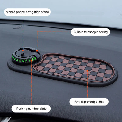 Car dashboard with a checkered phone stand, parking number plate, and anti-slip storage mat.